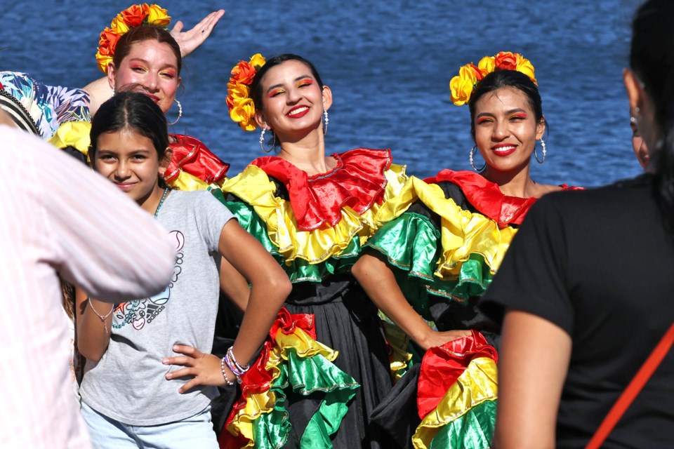 Performers pose for photos at Carnival Barrie on Sunday along Barrie's waterfront at Will Dwyer Park along Lakeshore Drive.