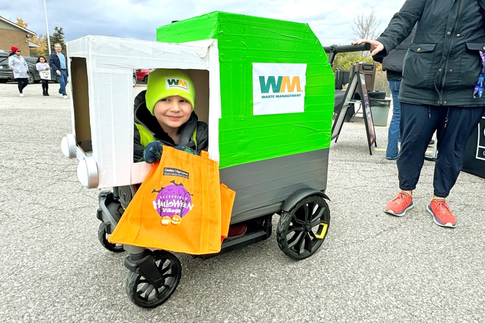 Six-year-old Miles Down visits Oatley Vigmond's Accessible Halloween Village in his custom ride on Sunday afternoon. The law firm hosted the free event for the second year in a row.