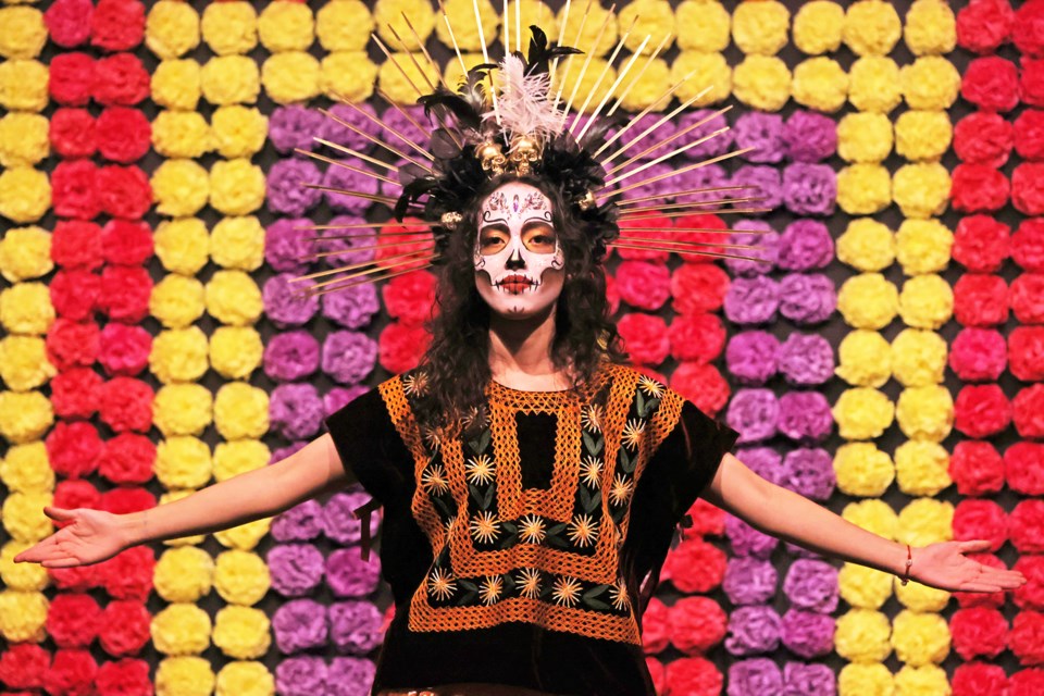 Denise Cervantes during an exhibition at the MacLaren Art Centre on Saturday, where visitors learned about the Ofrenda, which is a pivotal element of the Day of the Dead, renowned for its intricate details and symbolism and where skilled dancers and singers illuminate the history of the Day of the Dead in Mexico through their performances.