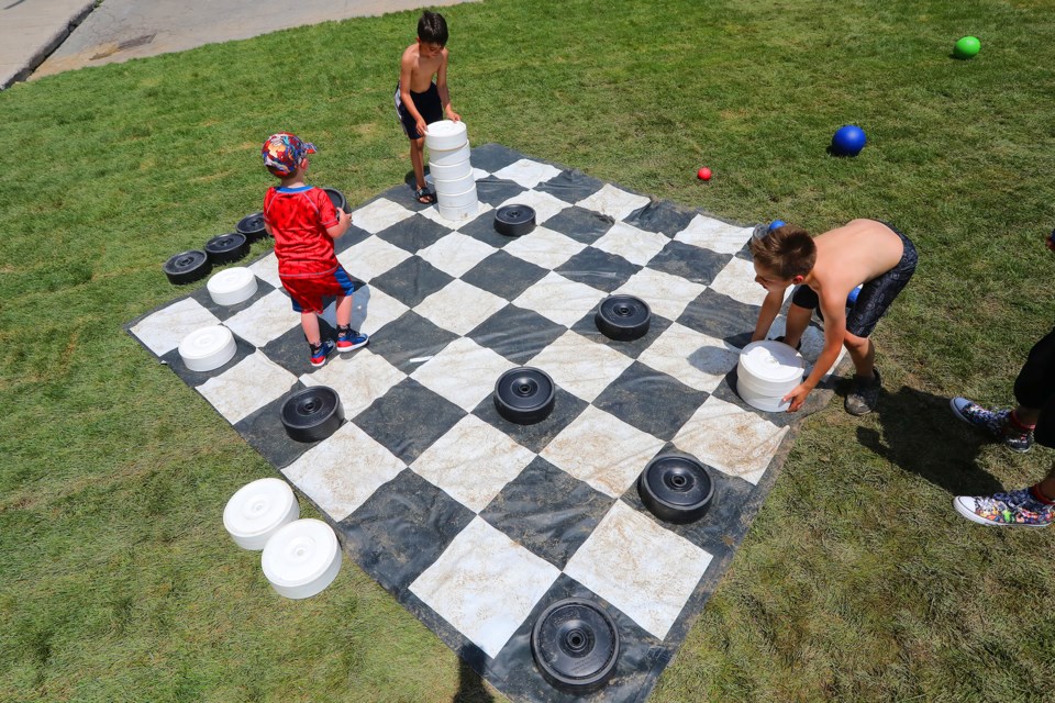 Youngsters make up their own game at the checkerboard at Promenade Days in downtown Barrie in this file photo. Kevin Lamb for BarrieToday