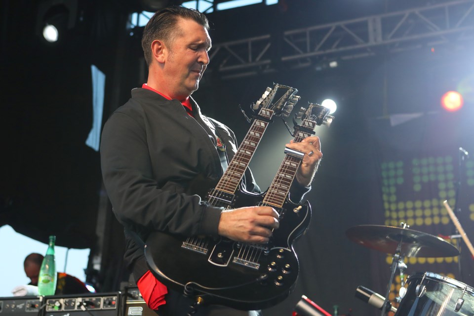 Gordie Johnson of Big Sugar rocks a doubleneck guitar at Kempenfest in Barrie on Saturday, August 4, 2018. Kevin Lamb for BarrieToday.