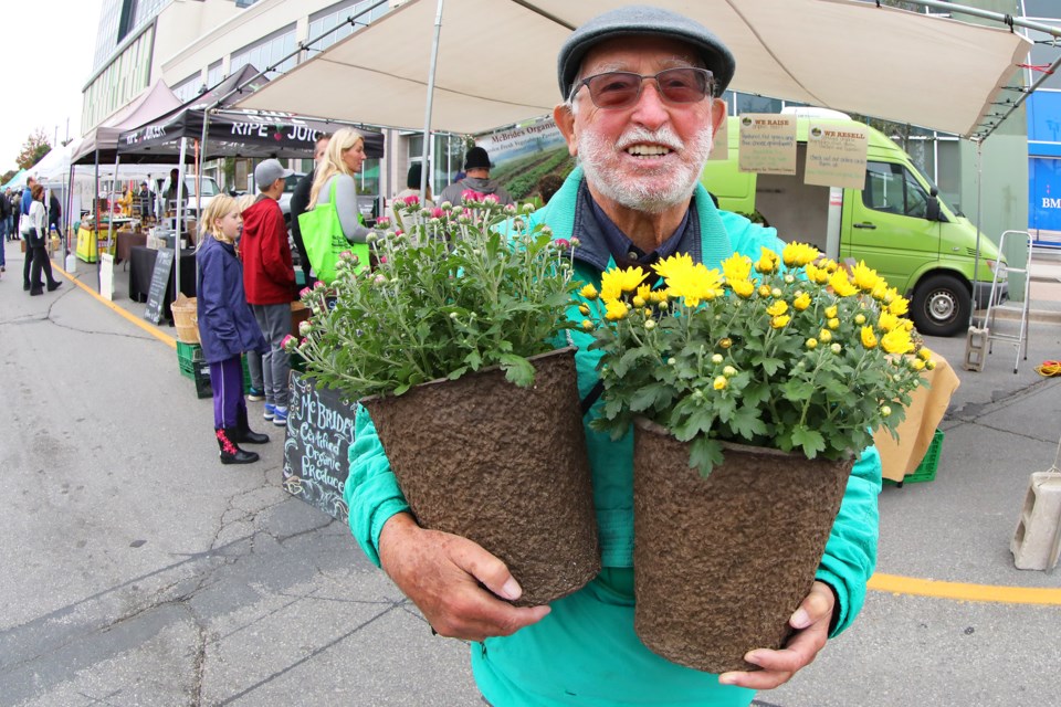 David Mair shows off his purchases at the Barrie Farmer's Market at City Hall. Kevin Lamb for BarrieToday