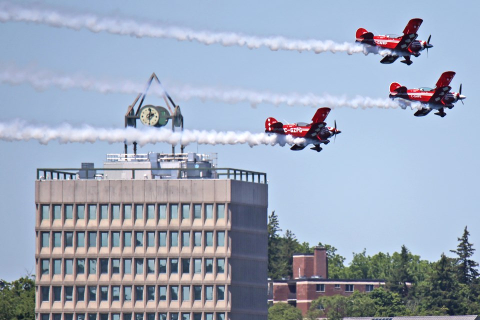 Members of the Northern Stars Aeroteam fly by the city's downtown during the Barrie Airshow on Saturday.