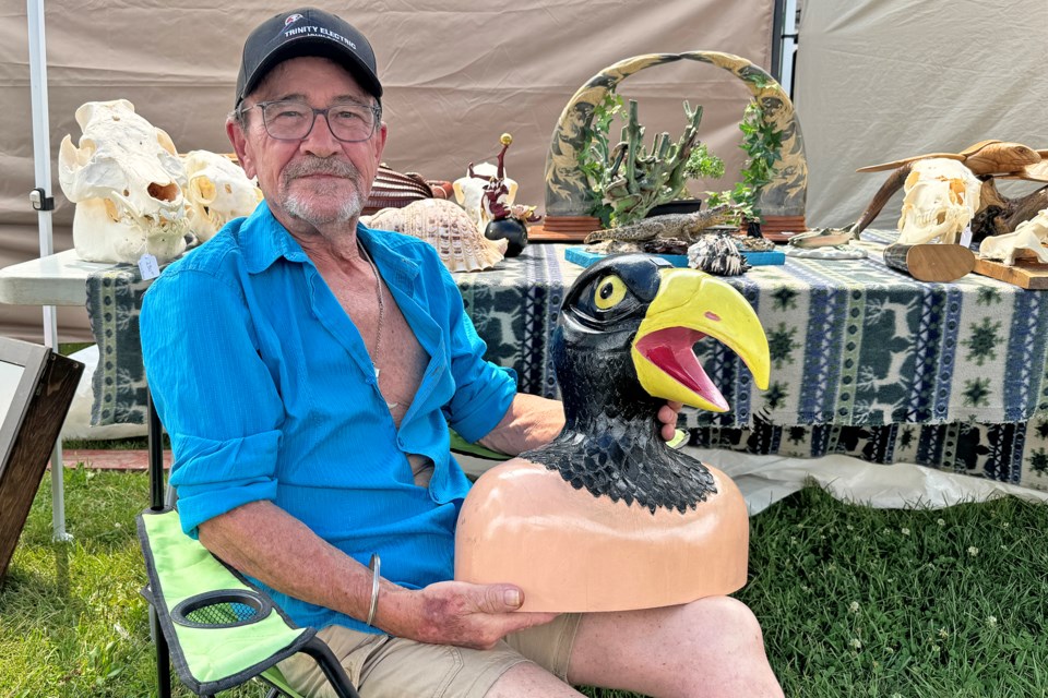 Oddities vendor Gordon Buist, of Montreal, shows off his strange wares at Kempenfest in Barrie on Saturday.