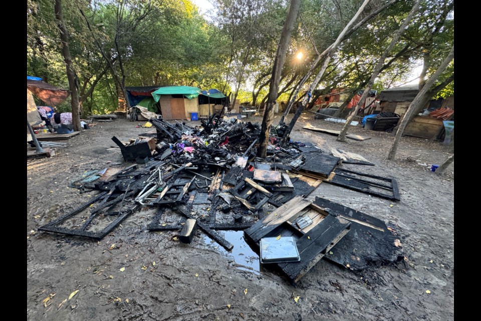 The remnants of Wednesday evening's fire at a Victoria Street homeless encampment in Barrie, as seen Thursday morning.