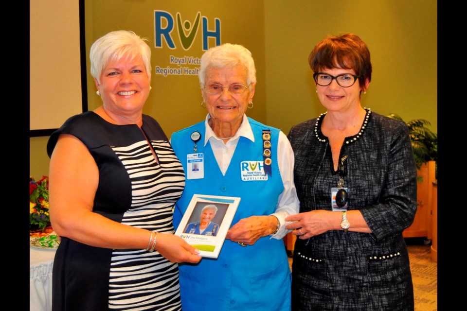 Joy Rodgers (centre) is recognized for her 40 years of volunteer service at RVH by Lise McCourt (left), president, RVH Auxiliary and Janice Skot, RVH president and CEO. Photo by Jane Cocking