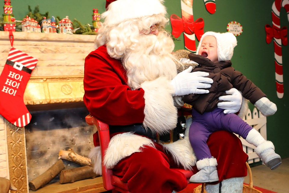 One-year-old Payton Hielema isn't so sure about this whole Santa thing while visiting Drysdale’s Tree Farm's Christmas Village  on Saturday, Nov. 25, 2017.