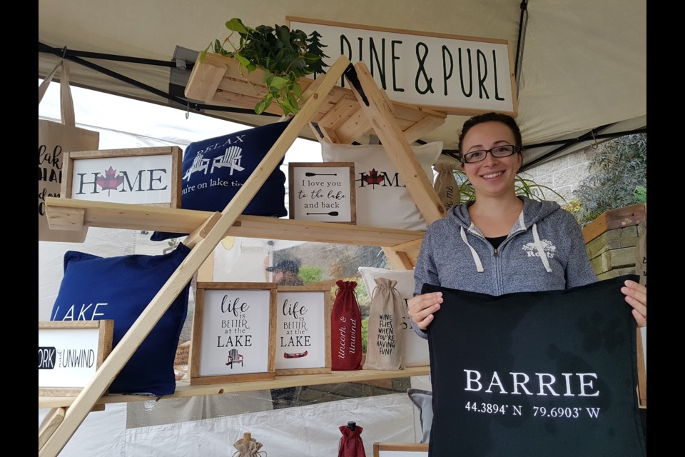 Andrea Fallone braved the wet weather to join the many crafty vendors at the Barrie Artists and Makers Market Saturday. Shawn Gibson/BarrieToday