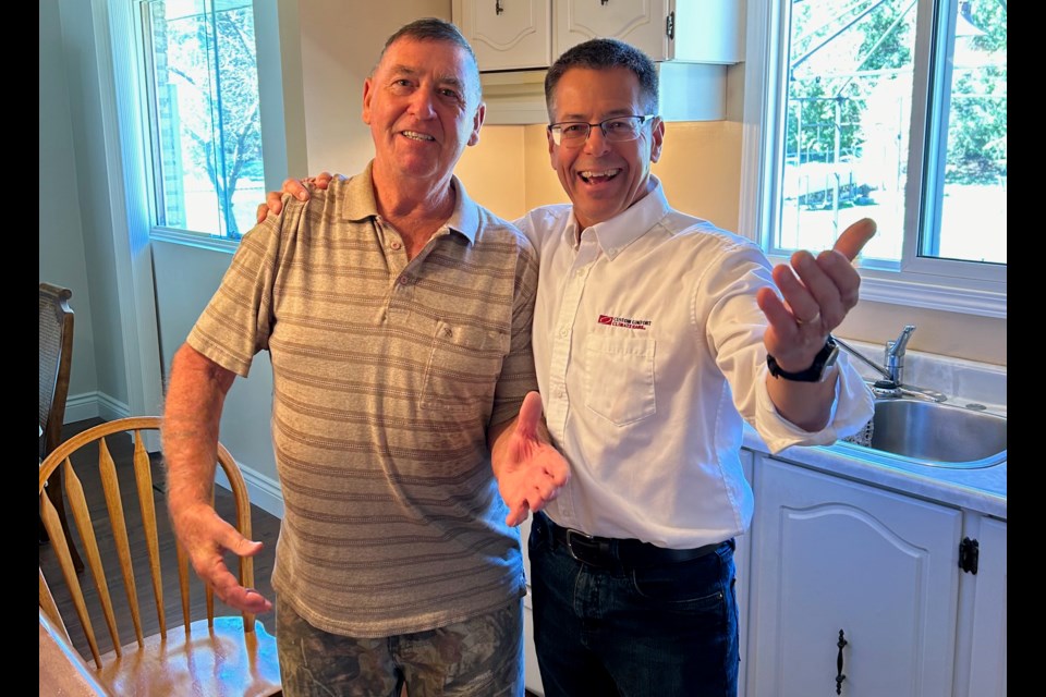 Barrie resident Barry Smith, left, won Custom Comfort ClimateCare's Oldest Furnace Contest. He is shown with Custom Comfort ClimateCare owner Rod Mysko.