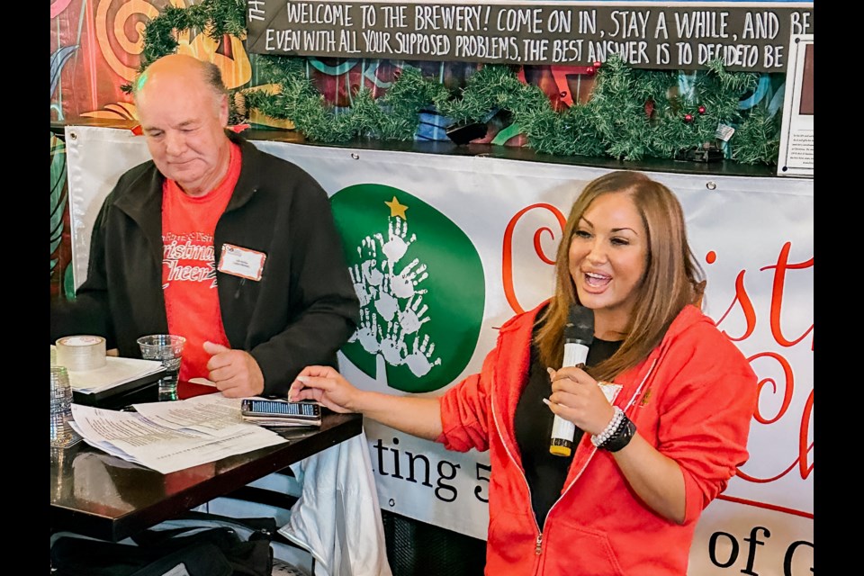 Barrie & District Christmas Cheer president Sandra Yaquo and legacy member Jeff Walther are shown.