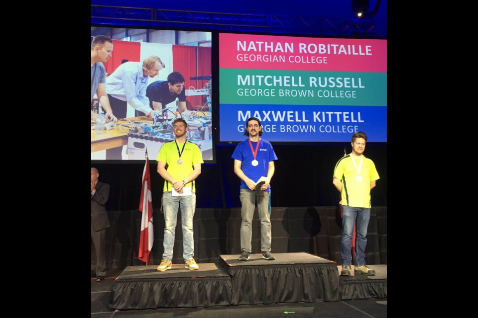 Georgian College CNC Precision Skills student Nathan Robitaille (centre), won gold at the Skills Ontario Competition held May 7 to 9. Supplied photo