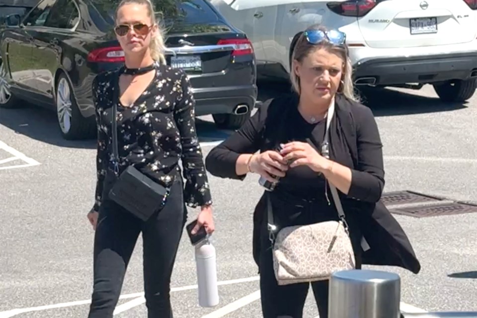 Cassie Korzenko, right, arrives at the Barrie courthouse on Friday, May 31 to be sentenced for three counts of impaired driving causing bodily harm following a crash in south-end Barrie on Dec. 1, 2022. She received a three-and-a-half-year jail term.