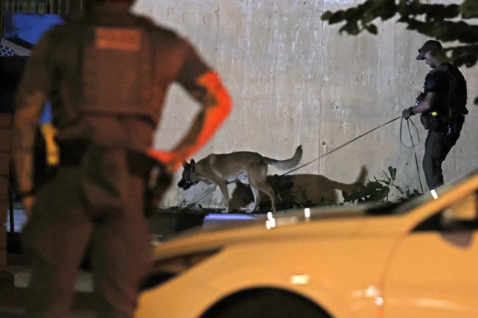 Police investigate a shooting at a Toronto Street home in downtown Barrie on July 11.