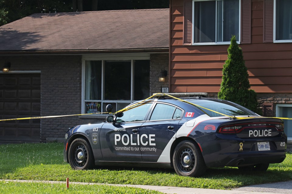 A police cruiser outside of a home on Grove Street East on Sunday morning, July 14, after a 75-year-old man was found deceased around midnight the previous night. A Barrie man was later arrested and charged with second-degree murder.