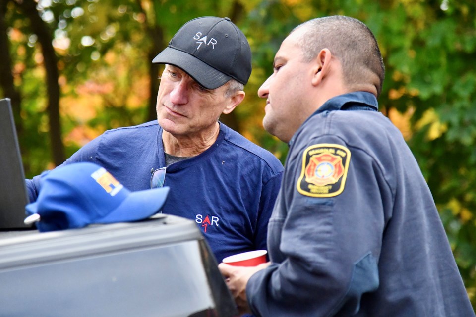 Volunteers in Sunnidale Park during a search for clues on Thursday in the case of a Barrie woman, Autumn Shaganash, missing since June 2023.