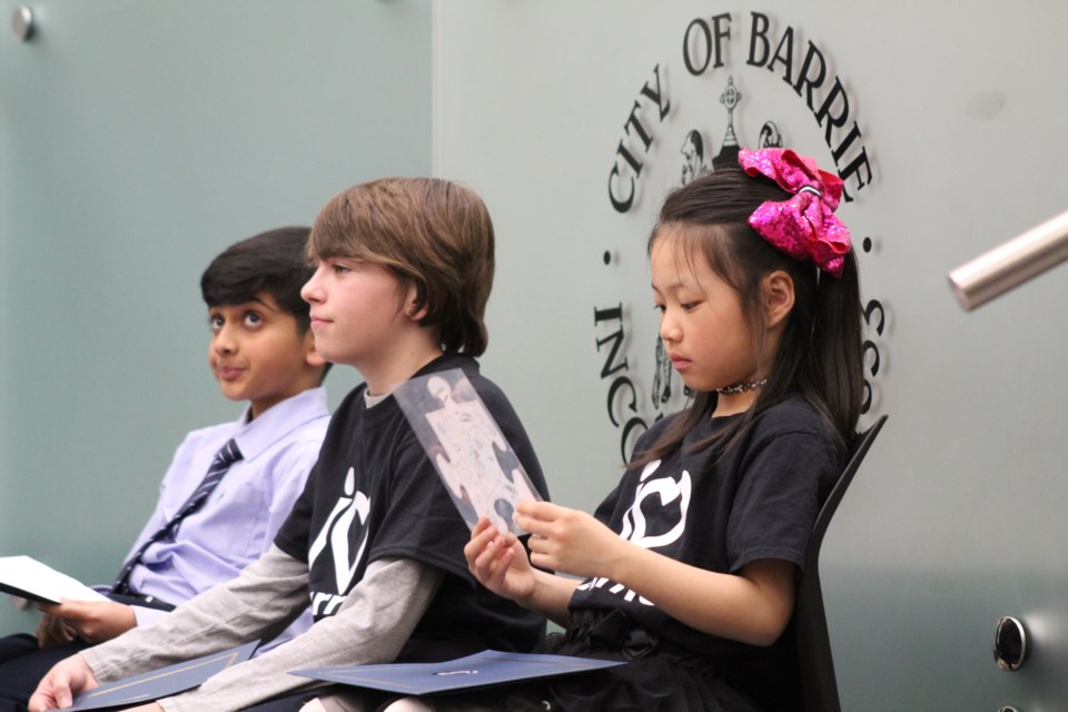 The I Love Barrie contest winners were brought before city council on March 25, 2019. They are, from left, Sanjit Narasimhan from Ferndale Woods, Evan Hutt from The Good Shepherd, and Carol Gao from Hewitt's Creek. Raymond Bowe/BarrieToday