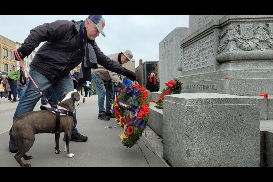 After the 11 a.m. moment of silence, those in attendance began to line up and leave their poppies at the Cenotaph, Thursday, Nov. 11, 2021.