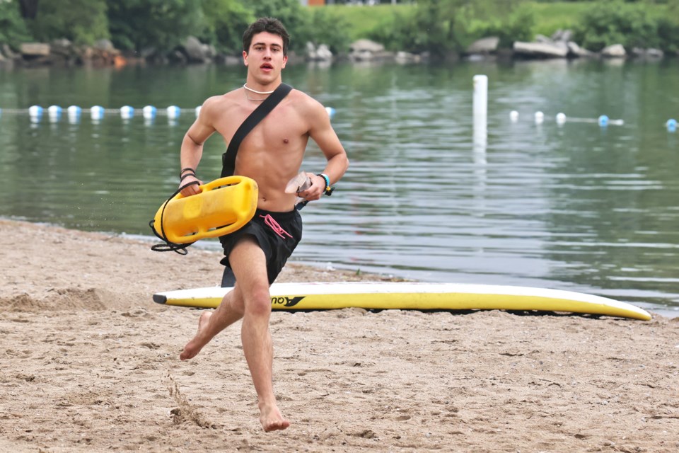 A lifeguard is run through his paces during training at Centennial Beach in Barrie on Saturday, June 22.