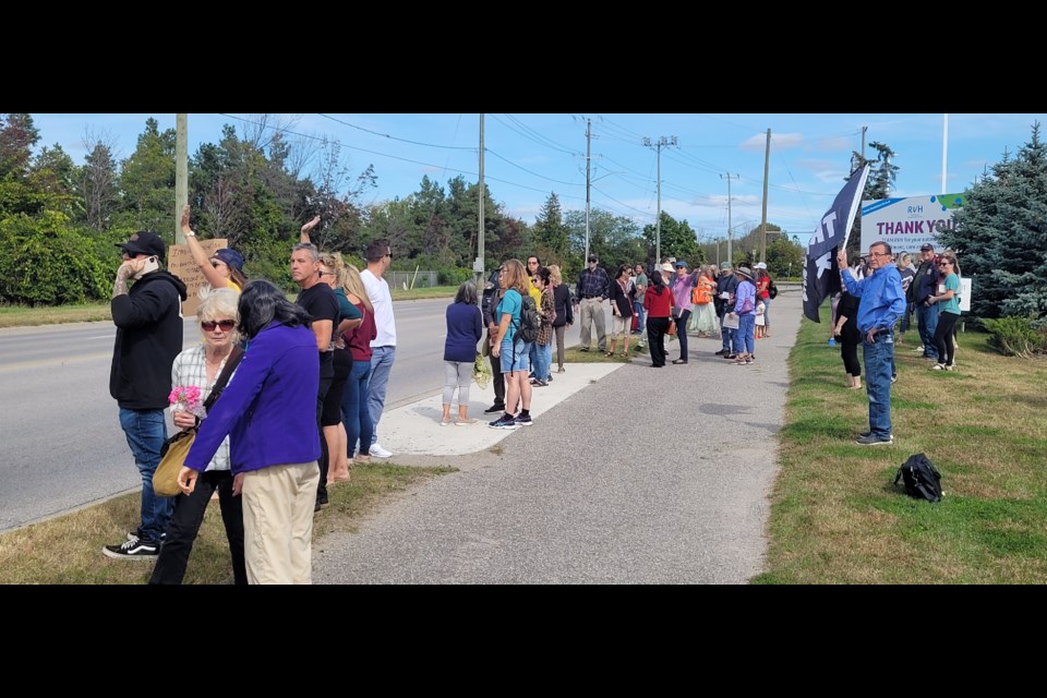 Protesters stood by Georgian Drive outside Barrie's Royal Victoria Regional Health Centre on Monday.