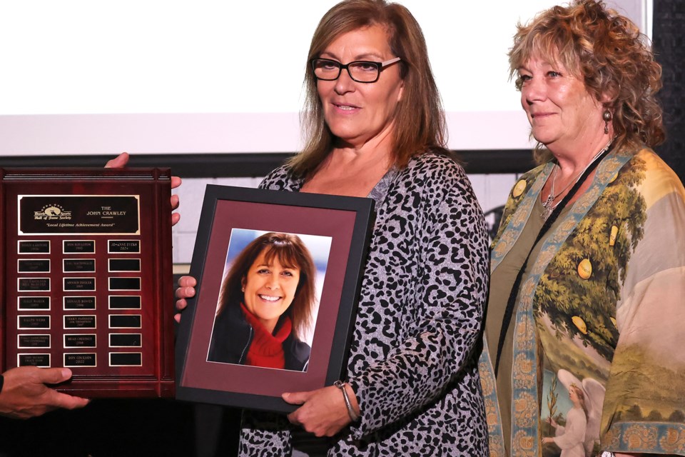 The sister of Jo-Anne Eyers accepts the John Crawley Lifetime Achievement Award at the 2024 Barrie Sports Hall of Fame Induction Ceremony at the Allandale Recreation Centre in Barrie on Wednesday, Oct. 2.