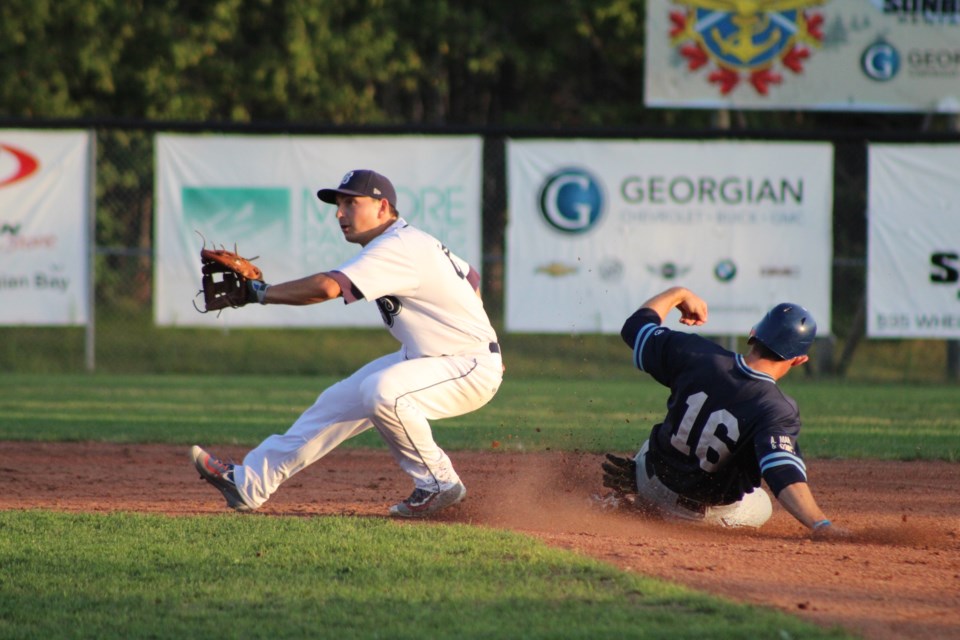 Barrie Baycats second-baseman Jeff Cowan tries to come up with the tag after a Toronto Maple Leafs player stole the base. The Baycats came back to win 15-10 on Thursday night in Intercounty Baseball League action at Coates Stadium. Raymond Bowe/BarrieToday