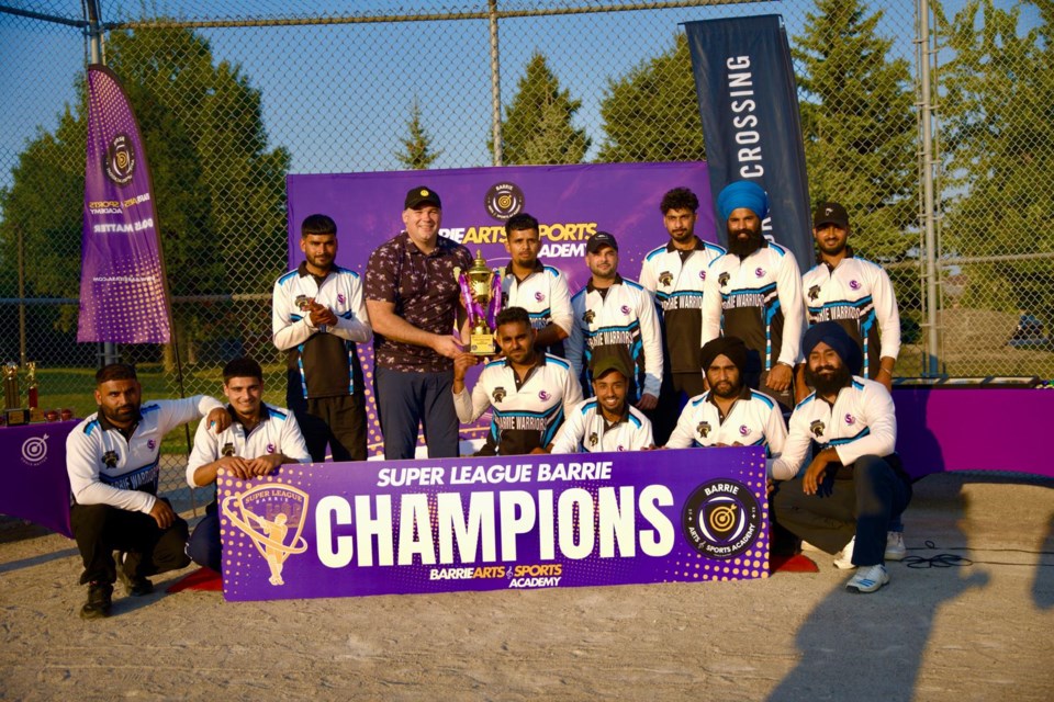 The Barrie Warriors won the inaugural Super League Barrie cricket season. They are shown with Mayor Alex Nuttall.