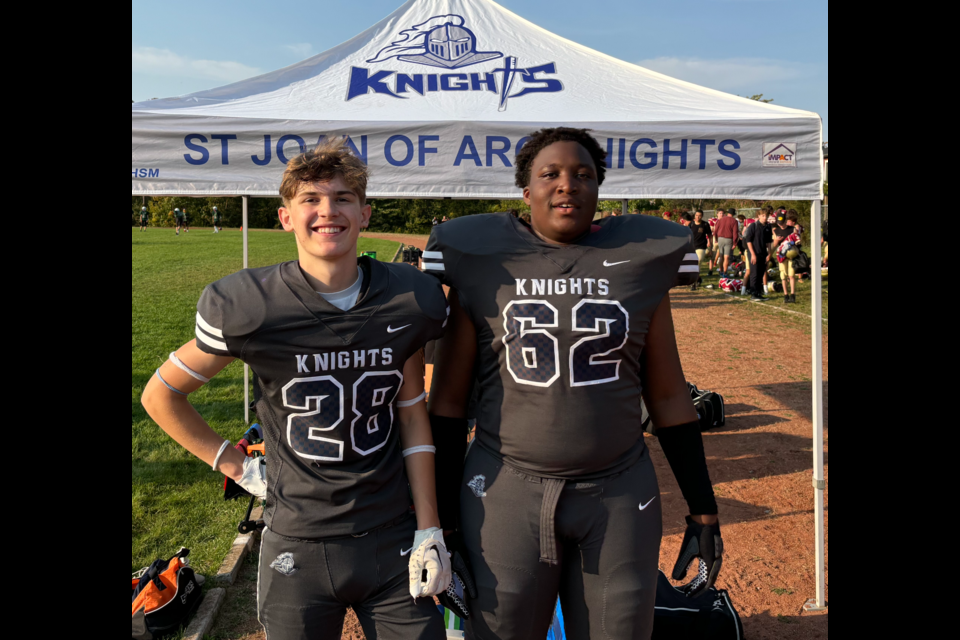 Defensive back Lukas Charbonneau, left, and offensive lineman Mikael Usiohen helped lead the St. Joan of Arc Knights to a 35-10 win over the visiting St. Joseph's Jaguars on Thursday  afternoon in south-end Barrie. 