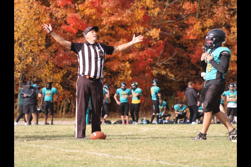 A referee welcomes the sunshine during SCAA senior football action on Oct. 23, 2024 in Barrie between the Bear Creek Kodiaks and the Nantyr Shores Tritons.