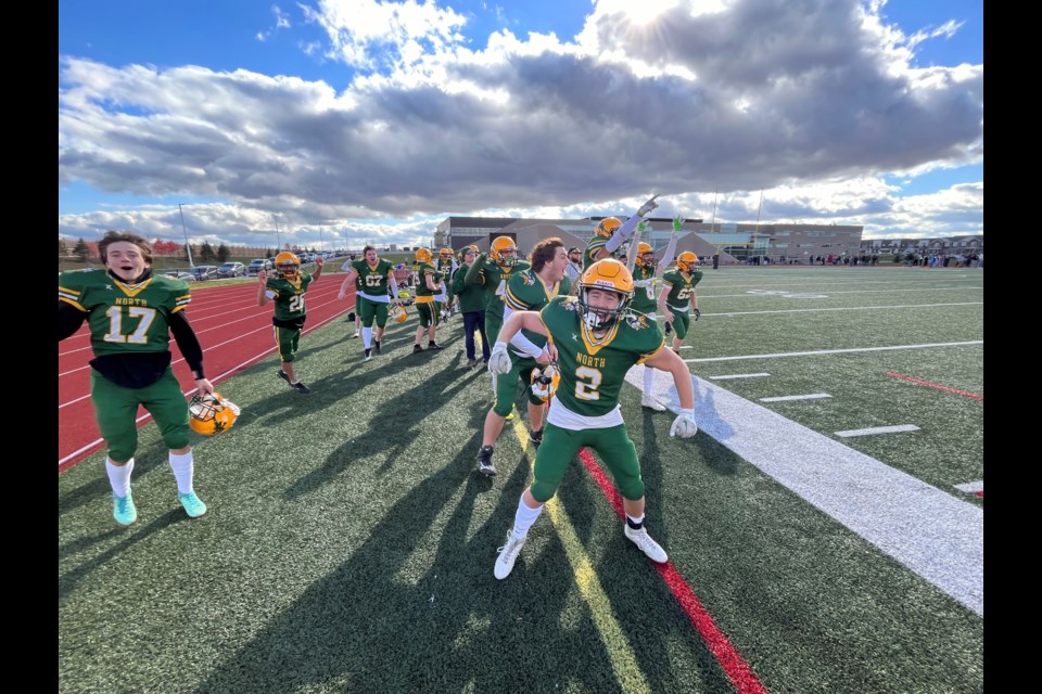 Members of the Barrie North Vikings react on the sidelines to an interception, and touchdown, against the Bear Creek Kodiaks in the Simcoe County Athletics Association (SCAA) championship game on Friday, Nov. 8 at Maple Ridge. Barrie North won, 23-0.