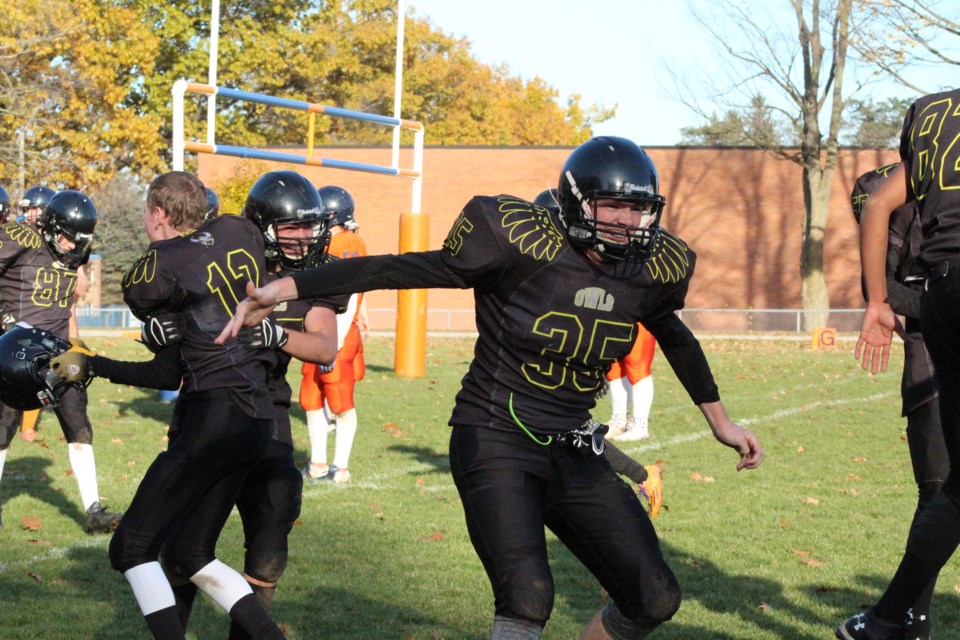 Members of the Collingwood Fighting Owls celebrate their last-second victory over the Innisdale Invaders, Tuesday, during the Simcoe County Athletic Association quarter-finals in Barrie. Raymond Bowe/BarrieToday