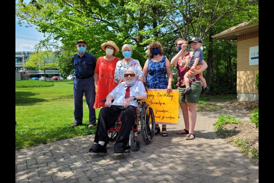 Thomas Stout, 100, is surrounded by five generations of his family on Friday for his birthday celebrations.