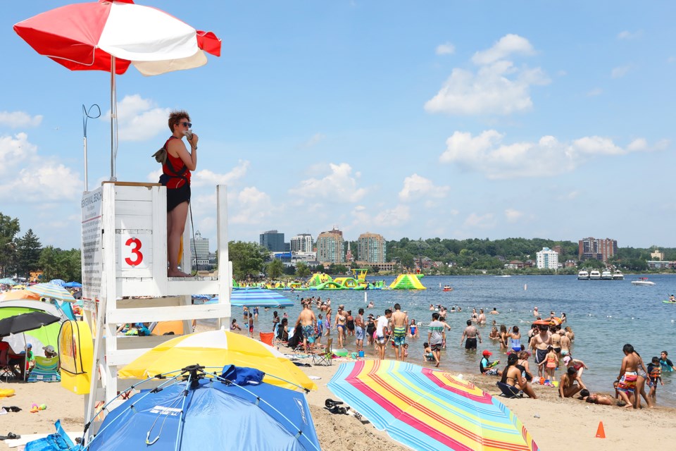 A lifeguard keeps watch over beachgoers at Centennial Beach as a heat wave gripped the city as temperatures soared into the mid-30s this weekend in Barrie. Sunday, July 1, 2018. Kevin Lamb for BarrieToday