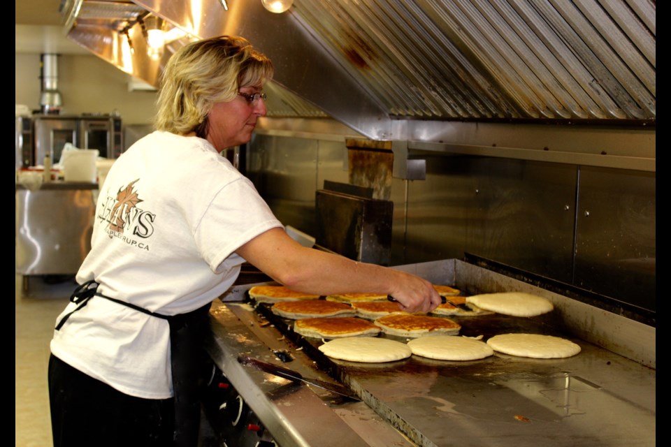 Terri-Lynn Shaw flips a batch of pancakes at 