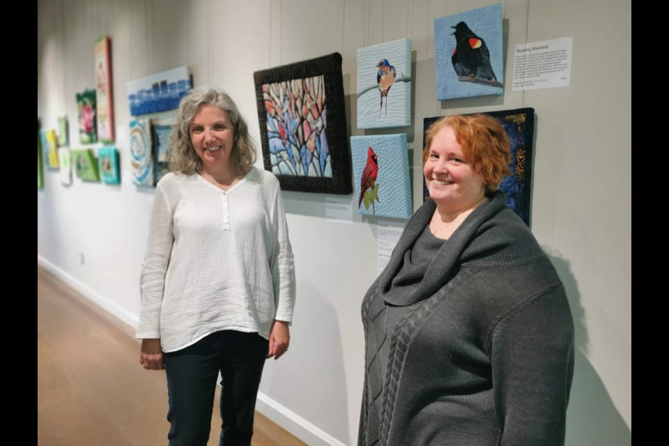 Kelley Swift Jones, curator of the Simcoe County Museum, left, and Christie Goggins, exhibit designer at the museum, check out the Stories from Nature exhibit currently on at the museum.