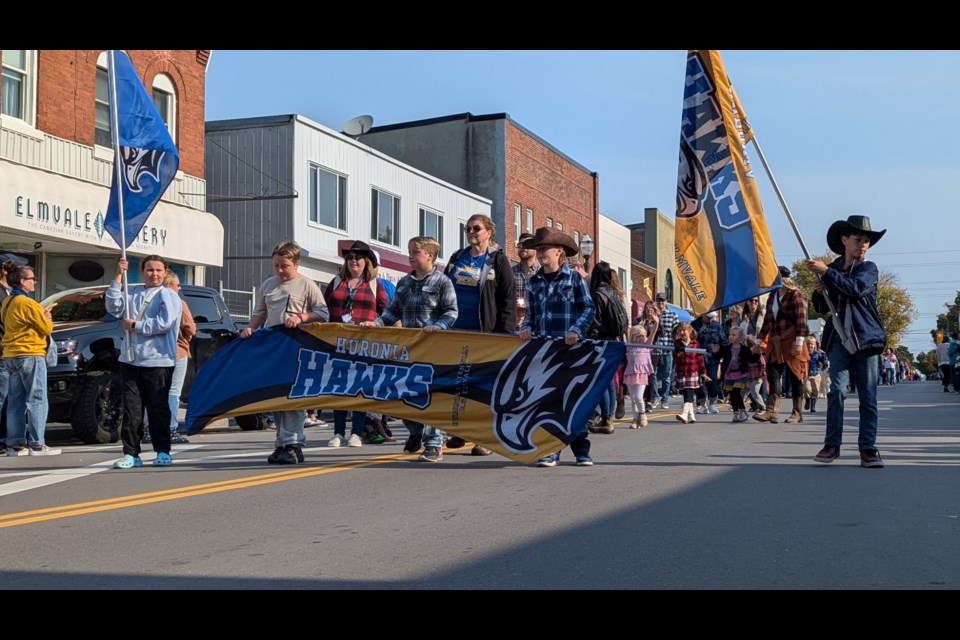 The Huronia Hawks show off their colours during the children's parade to kick off the Elmvale Fall Fair Friday.