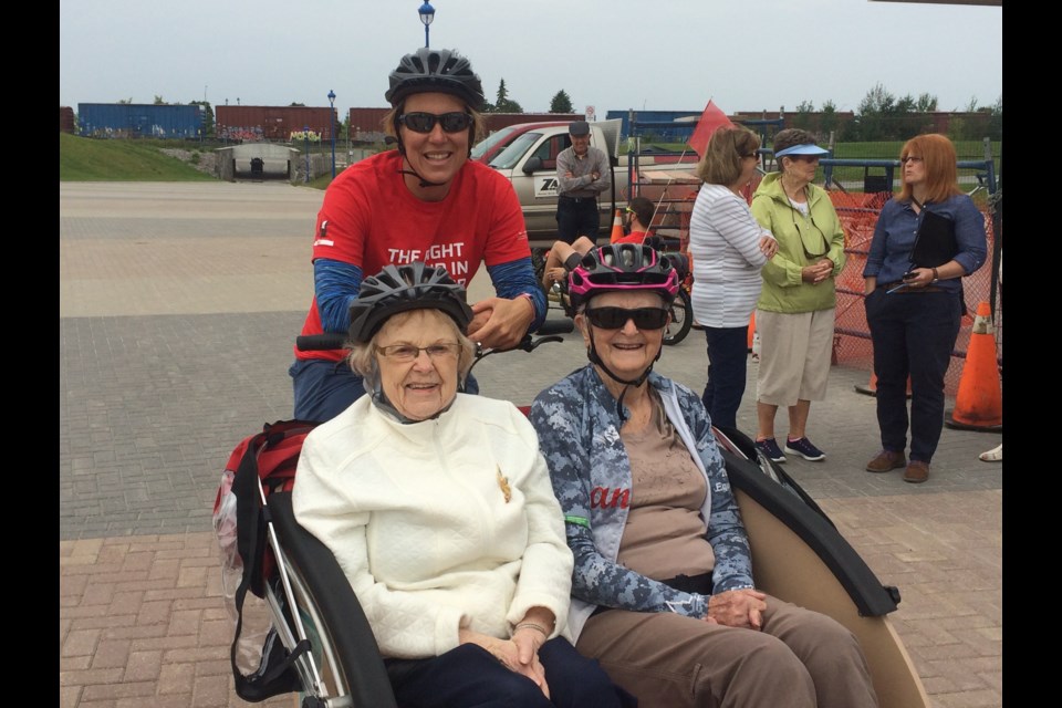 Empire Living Center residents enjoying a ride in a Trishaw Bike 