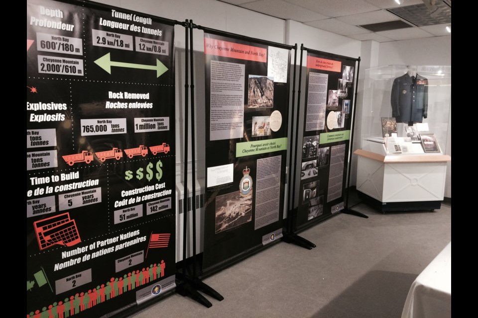 Below! NORAD's Underground Fortress recognizes NORAD's 60th anniversary.