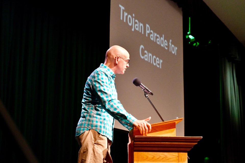 Teacher Mark Robertson speaks to students at West Ferris Intermediate and Secondary school about the upcoming Trojan Parade for Cancer
photo courtesy Tom Martineau