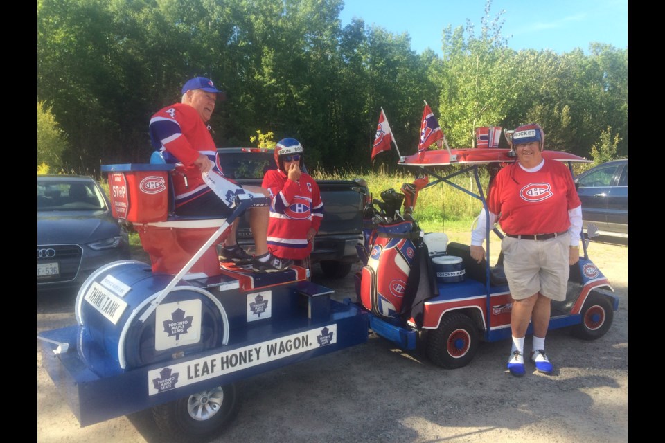 (L to R) Mike Perreault, Andy Boissonneault and Joffre Ribout show their devotion to the Habs during the annual Leafs fans vs Habs fans golf tournament for the North Bay North Stars hockey teams. 