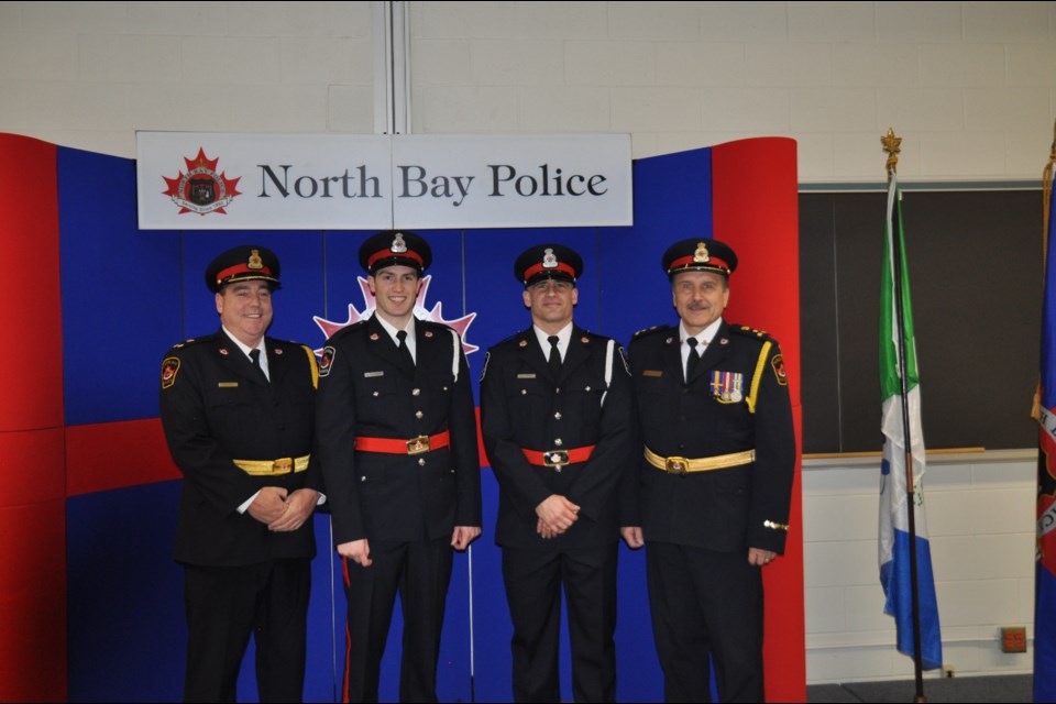 Constable Shawn Hoffman (2nd from left) and Constable Russ Moyer (to the right of Hofmann) following swearing-in ceremony at North Bay Police Headquarters