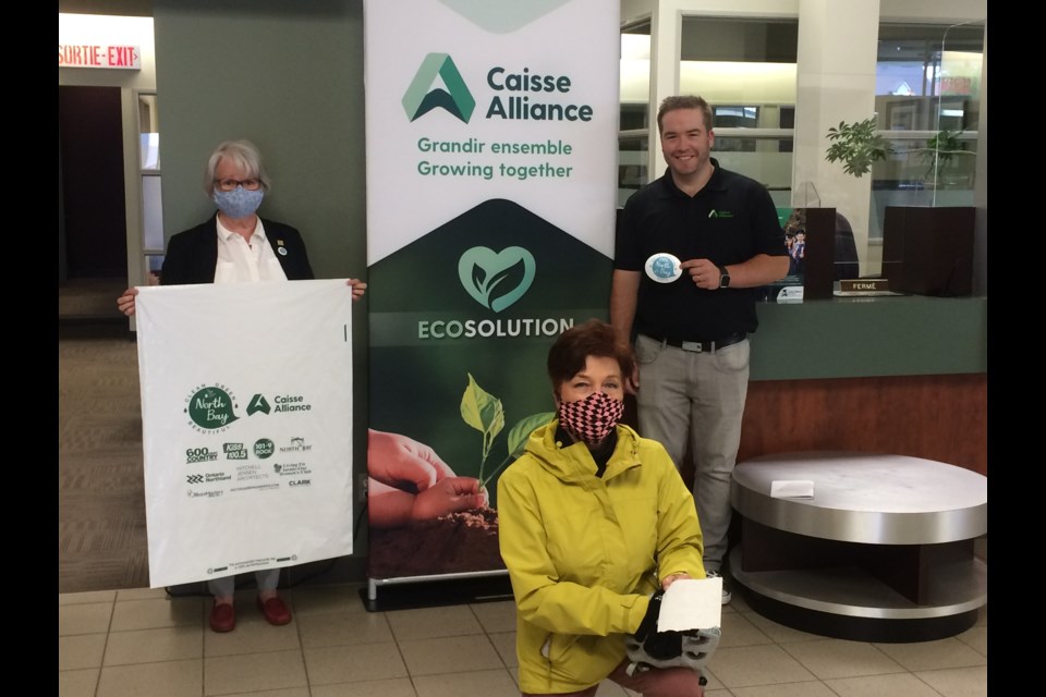 (l-r) Clean Green Beautiful North Bay committee chair Johanne Brousseau, committee member Hariett Madigan and Caisse Alliance's Mathieu Shank kick off BYOBG-Bring Your Own Bag and Gloves to pick up litter
photo: Linda Holmes