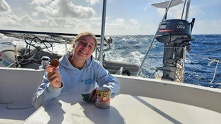 Hannah Gignac on day four of the passage across the Indian Ocean from The Seychelles to Tanga, Tanzania Africa. Taking a break after her morning shift.