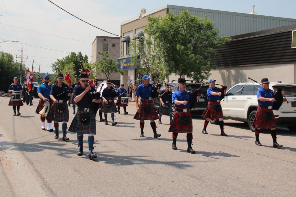 The Legion pipe band fill main street with its music