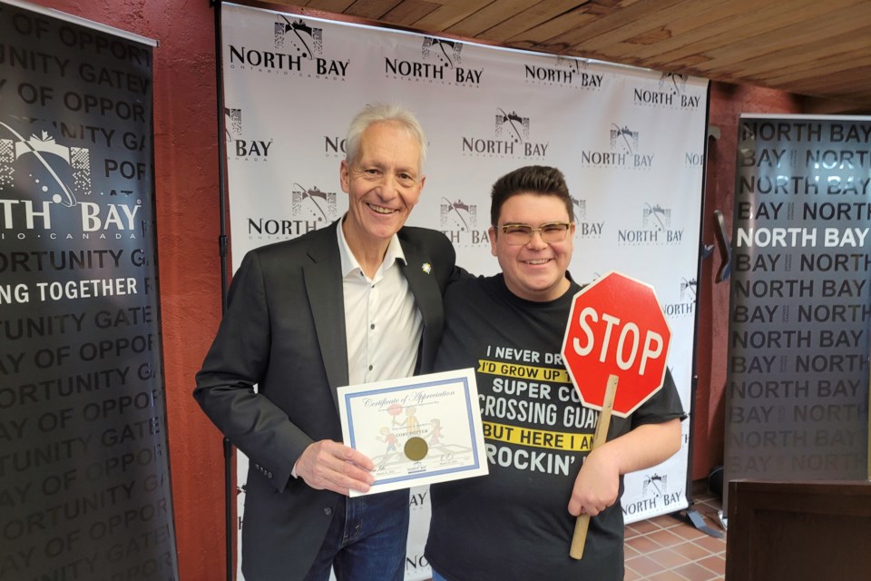 Mayor Peter Chirico with Cory Potter, one of the North Bay's loyal crossing guards who were honoured today / Photo by David Briggs 