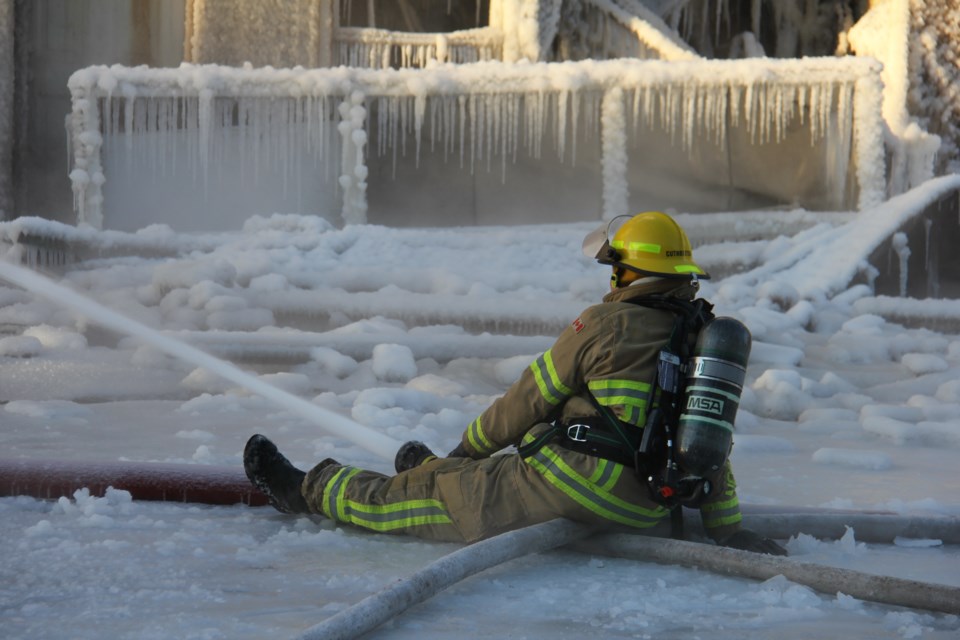 Firefighter sits frozen in the ice pouring water on the blaze in minus 20 degrees. Jeff Turl/BayToday.