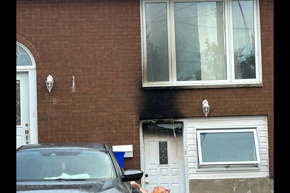 Scorch marks can be seen above the door of an attached garage at 98 Belleview Cres.