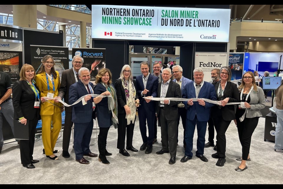 Northern Ontario MPs, regional mayors, dignitaries, steering committee members and FedNor representatives attend a ribbon cutting to officially open the FedNor-funded Northern Ontario Mining Showcase.