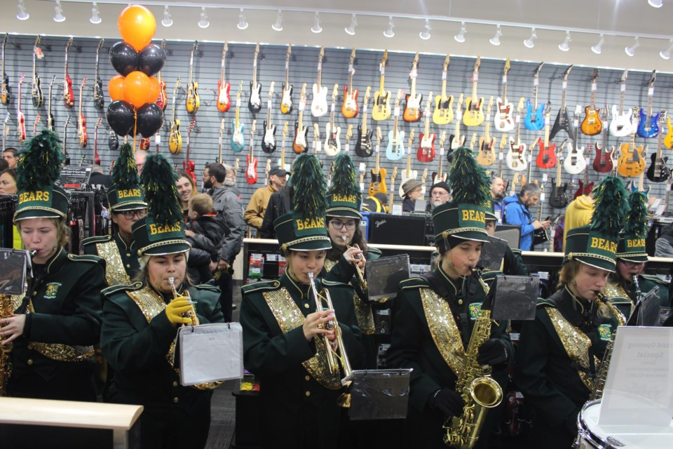 St. Joseph Scollard Hall's marching band played the ribbon cutting at the new storefront. Photo by Ryen Veldhuis.