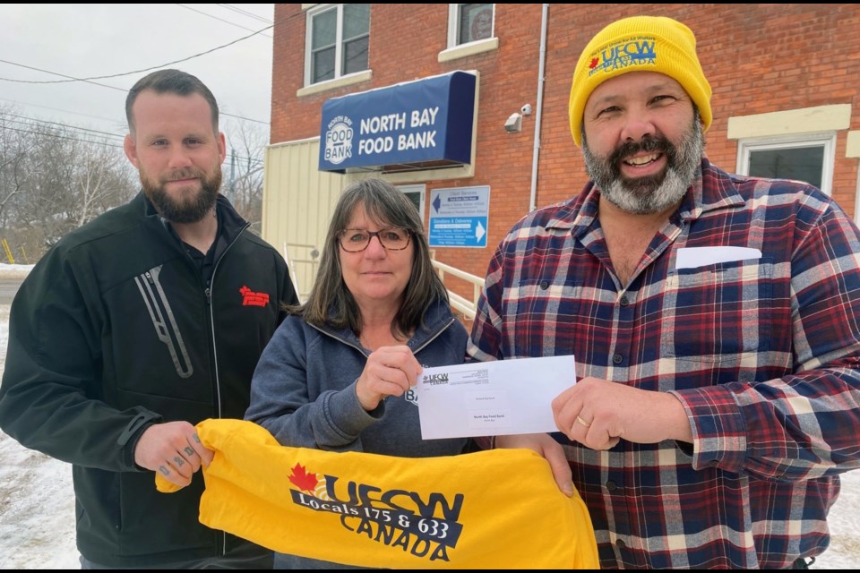 UFCW Local 175 Members Jessie Wilson (L) and Scott Gaboury (R) present North Bay Food Bank Executive Director Debbie Marson with a $3,000 donation, part of $200,000 donated across Ontario.