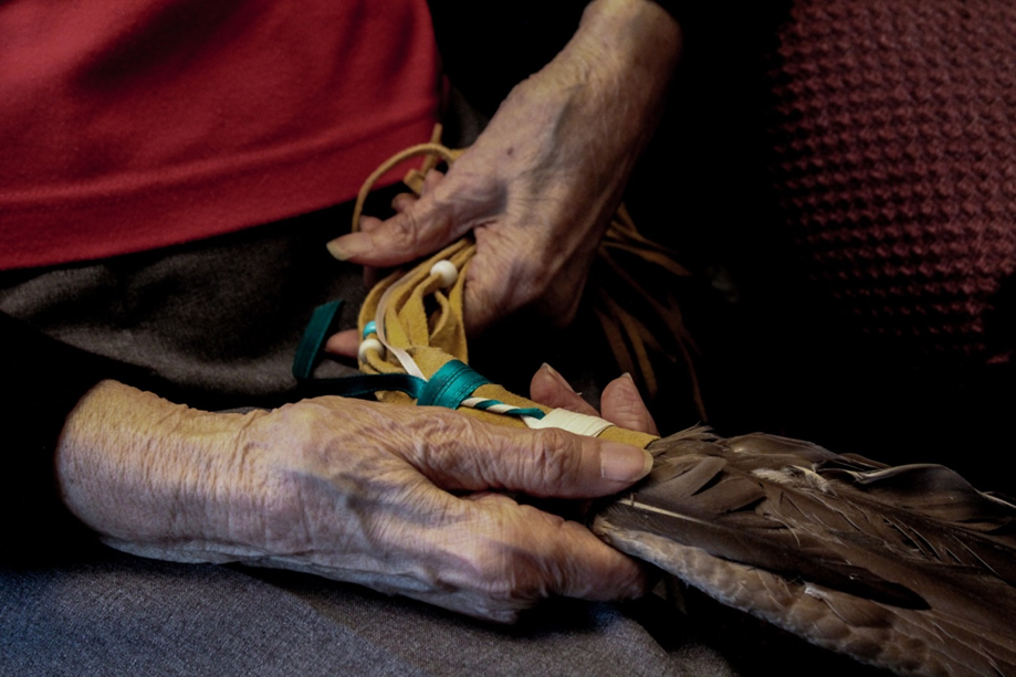 Bobbie M. Age: 17.A Lifetime in my Grandmother’s Hands. “Through all that she has lost, my Grandmother is still trying to reconnect with parts of her lost culture. The goose wing she is holding in the photo is a cultural item that my parents were wed with. This is symbolic of her refusing to lose her grasp on her heritage and how current generations can help rebuild that connection.”
